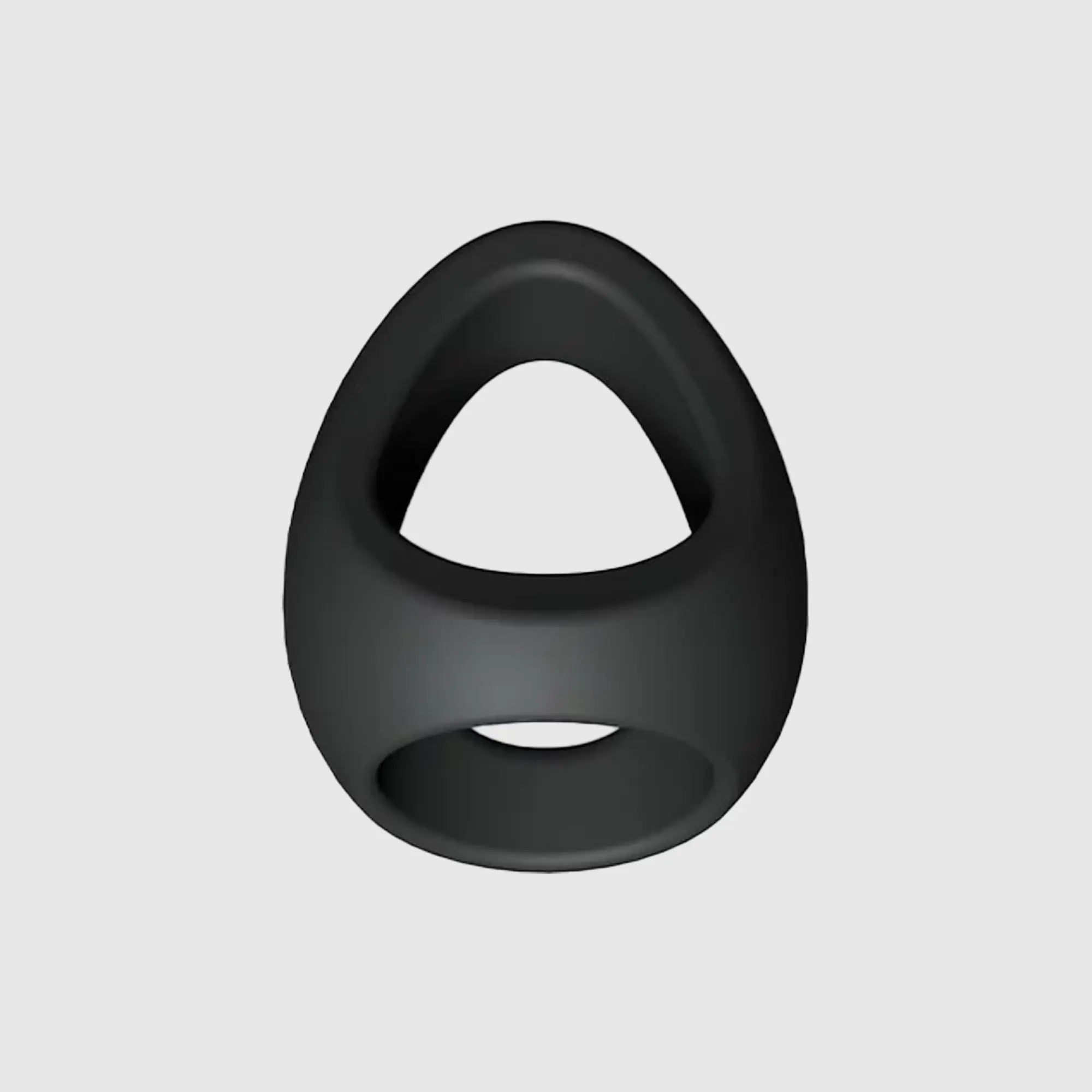 Double cockring silicone FLUX RING noir, présenté sous un angle latéral pour en montrer la forme