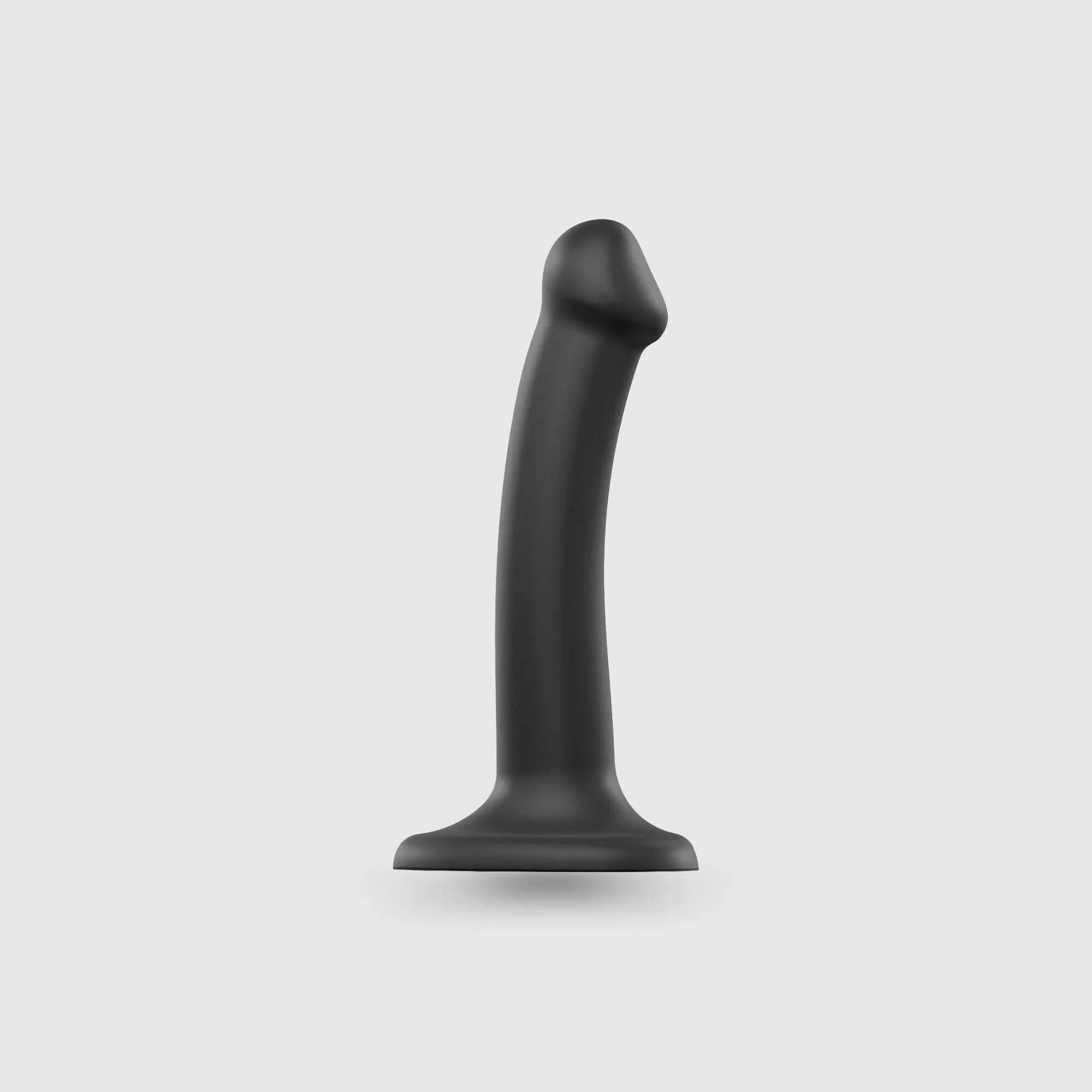 Gode en silicone noir avec ventouse et design réaliste.