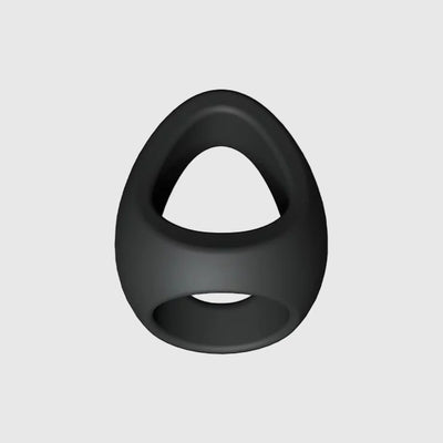 Double cockring silicone FLUX RING noir, présenté sous un angle latéral pour en montrer la forme