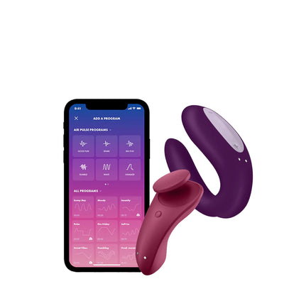 Les deux jouets Satisfyer Partner Box 1 à côté d’un smartphone, soulignant leur compatibilité avec l’application Satisfyer