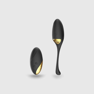 Sextoy œuf vibrant SECRET ORGASM en coloris noir et doré, mettant en avant son design élégant